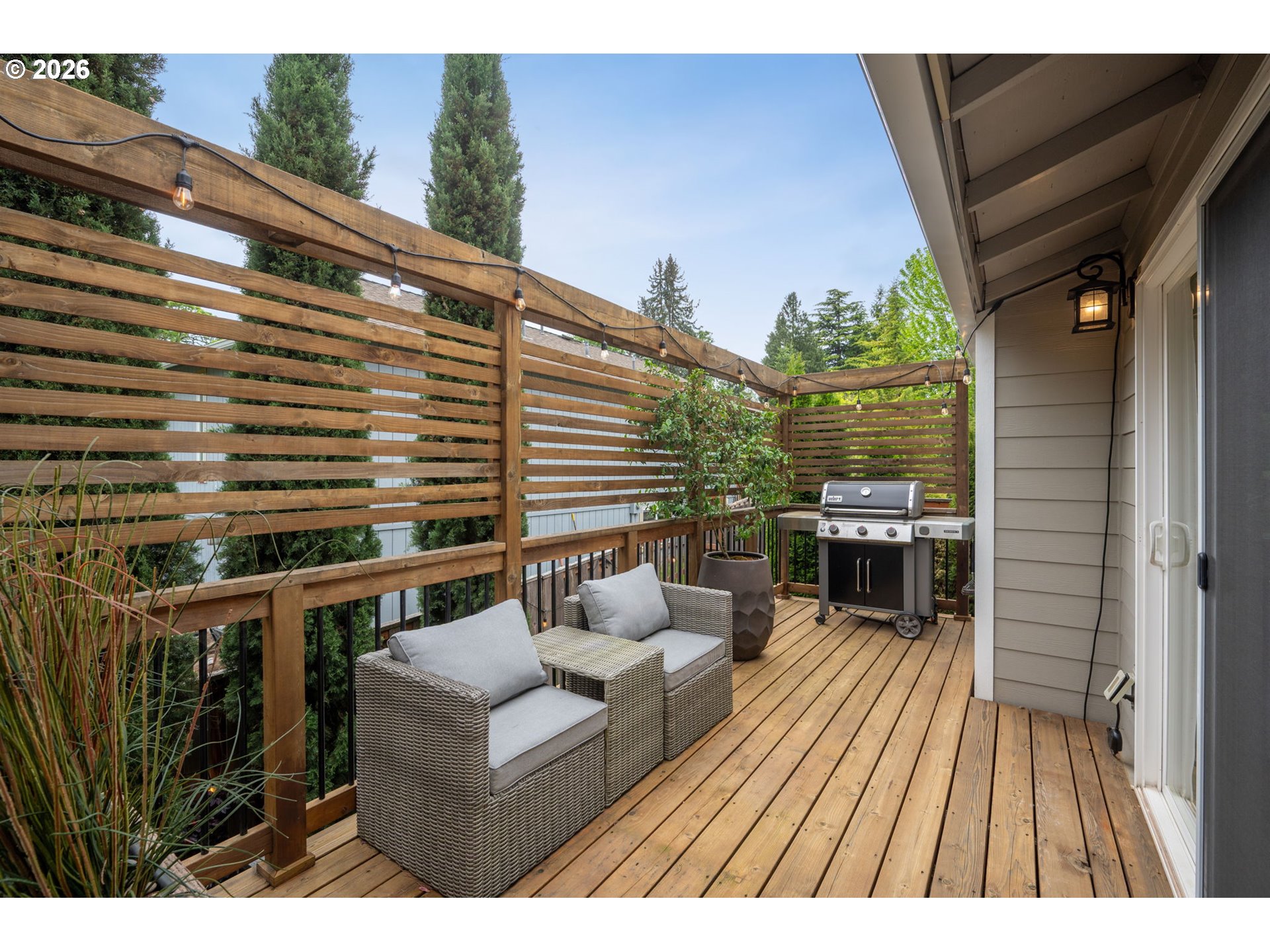 6330 Southwest Fisher Avenue Beaverton, OR 97008 - Photo 37 of 48 a balcony with table and chairs
