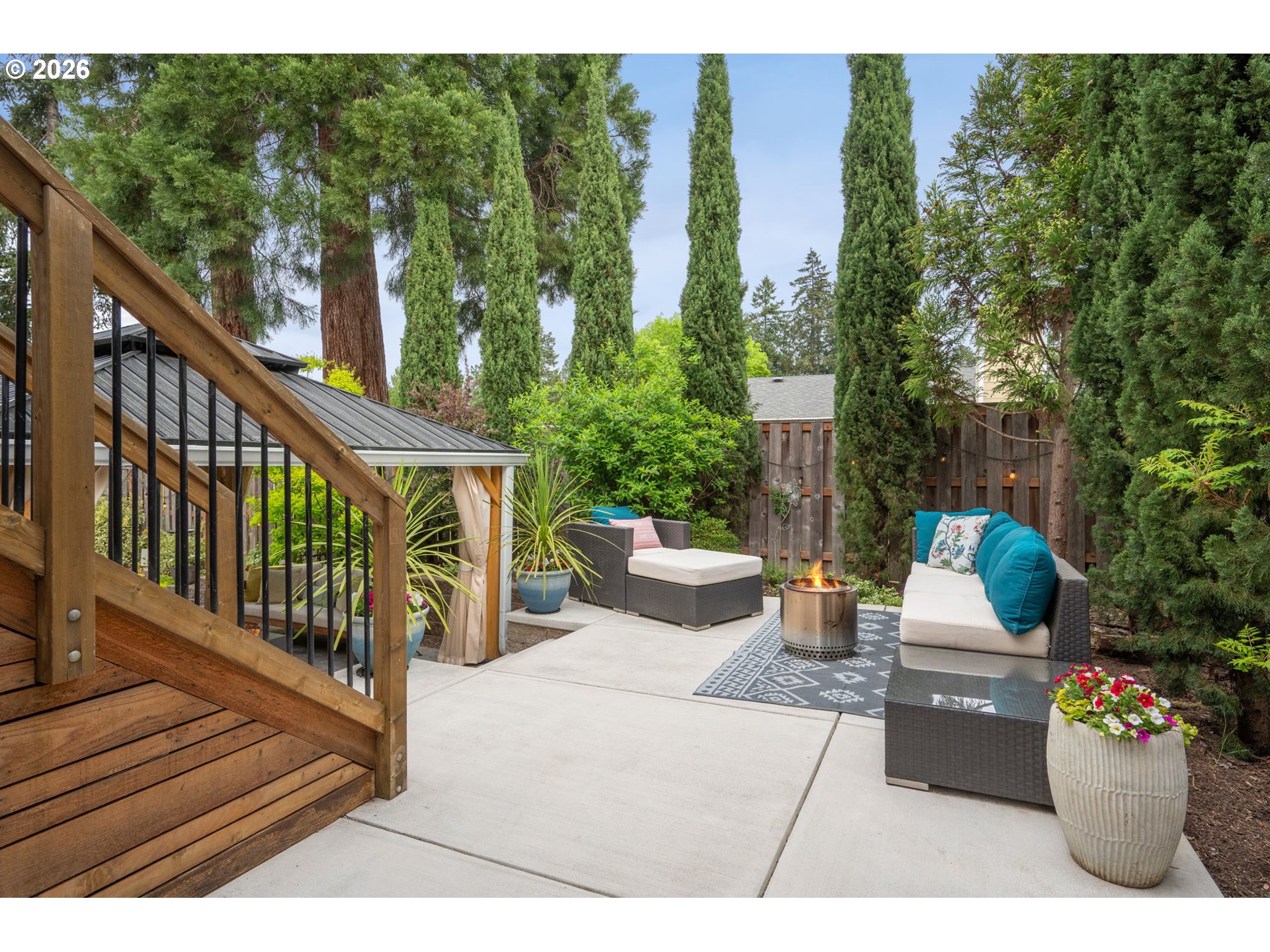 6330 Southwest Fisher Avenue Beaverton, OR 97008 - Photo 40 of 48 a view of a patio with couches table and chairs and potted plants