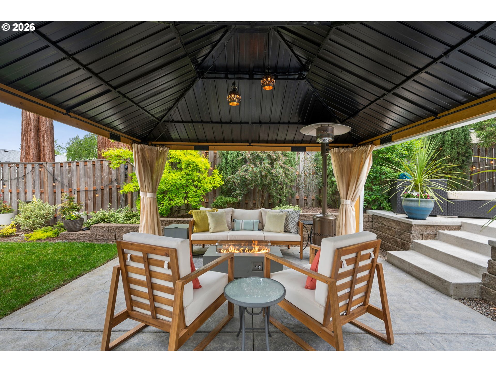6330 Southwest Fisher Avenue Beaverton, OR 97008 - Photo 42 of 48 a patio with a patio table and chairs with a barbeque grill