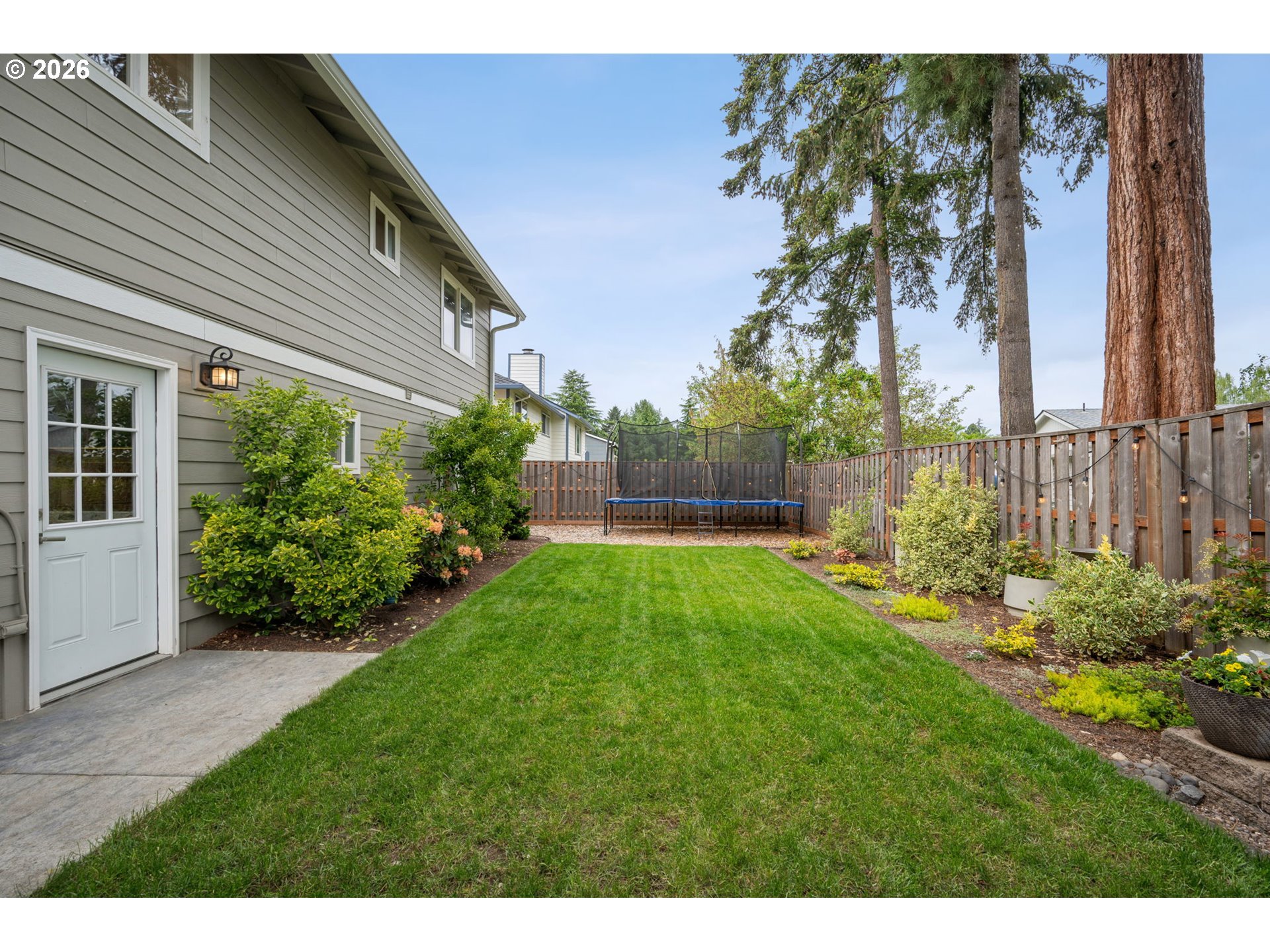 6330 Southwest Fisher Avenue Beaverton, OR 97008 - Photo 44 of 48 a view of yard with grass and plants