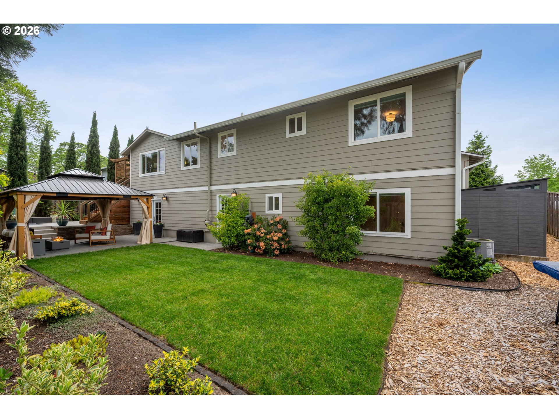 6330 Southwest Fisher Avenue Beaverton, OR 97008 - Photo 45 of 48 a front view of house with yard and outdoor seating