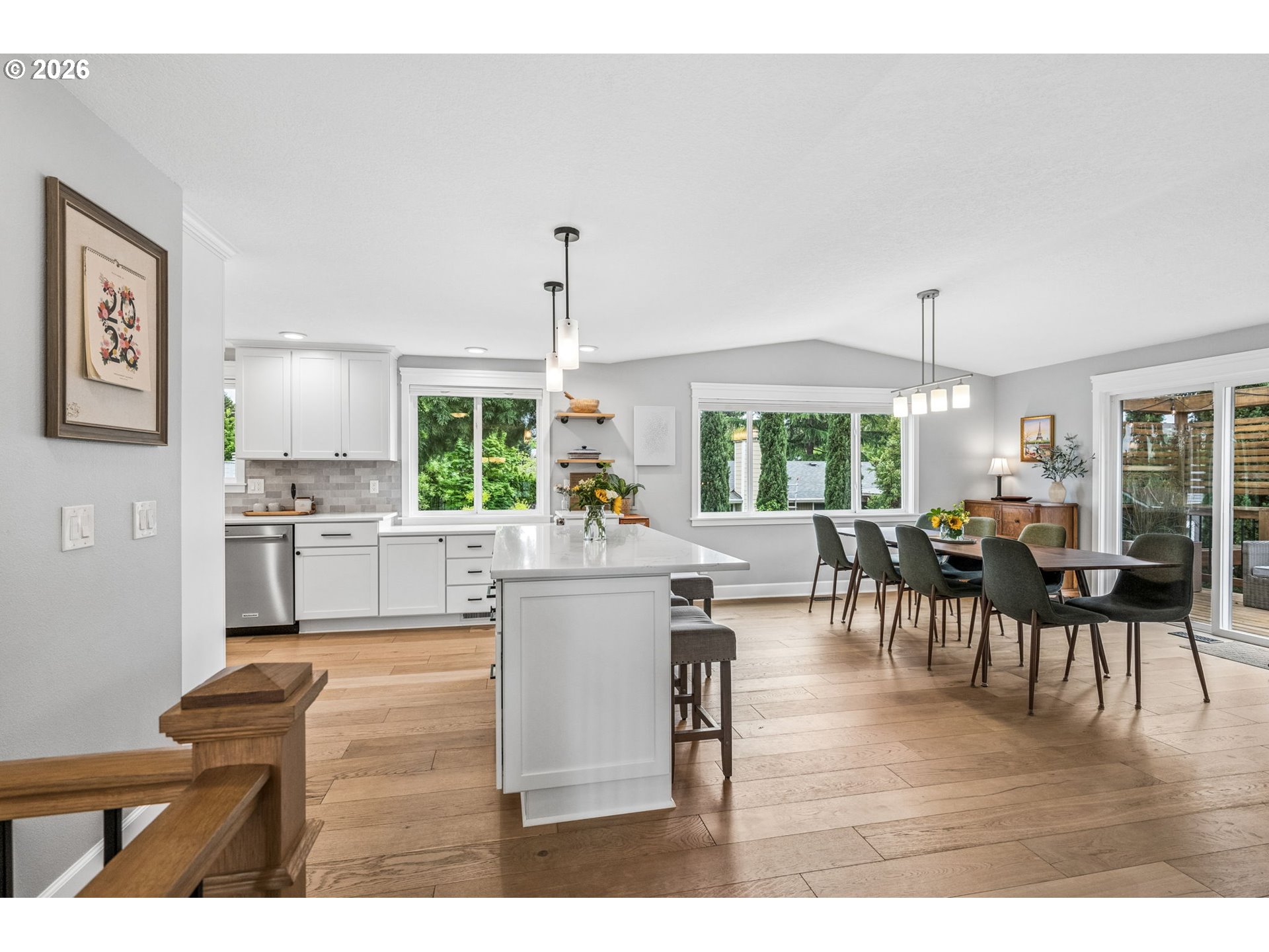 6330 Southwest Fisher Avenue Beaverton, OR 97008 - Photo 5 of 48 a living room with kitchen island furniture and a chandelier