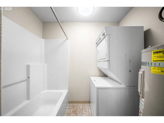 a kitchen with a refrigerator and a sink