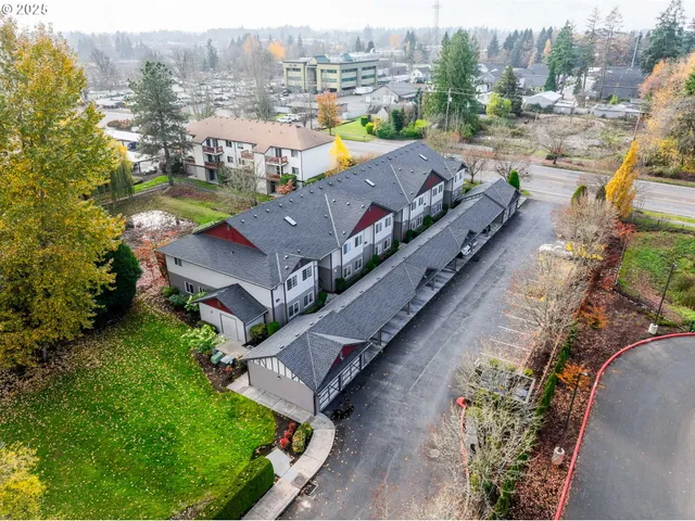 an aerial view of a house with a garden