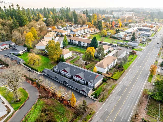 an aerial view of a house with a ocean view