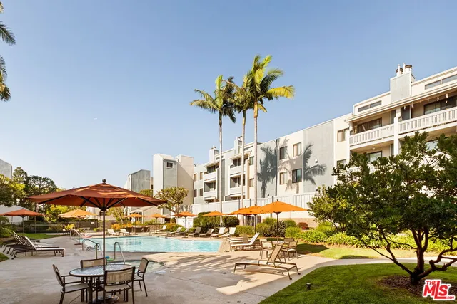 a front view of a building with garden