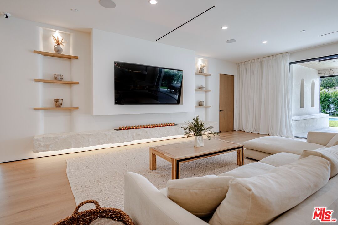 4703 Saloma Avenue Sherman Oaks, CA 91403 - Photo 12 of 26 a living room with furniture and a flat screen tv