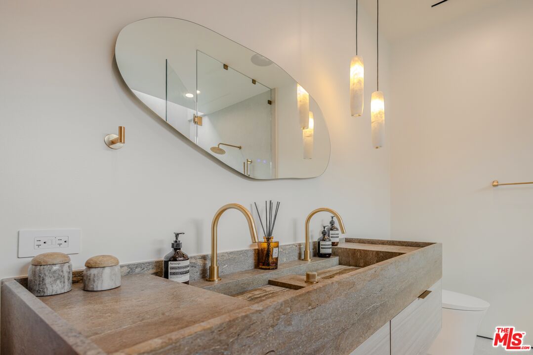 4703 Saloma Avenue Sherman Oaks, CA 91403 - Photo 18 of 26 a close view of sink and tap