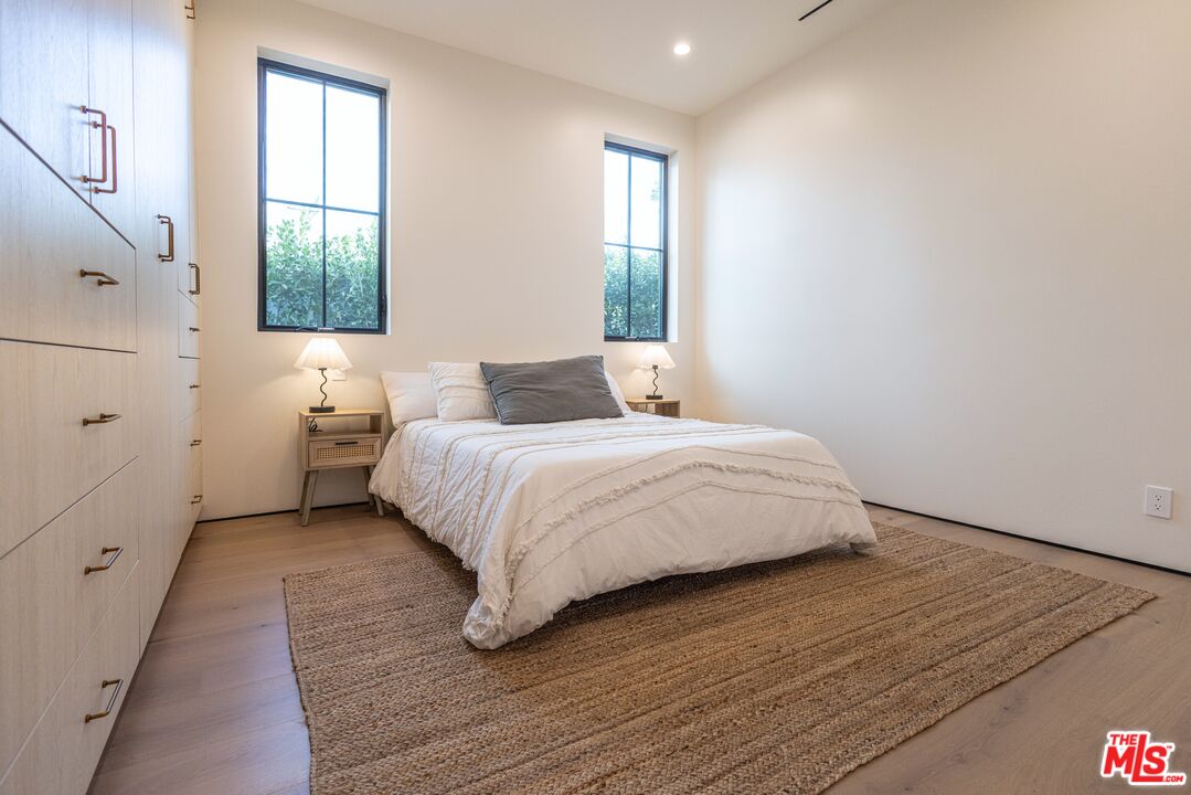 4703 Saloma Avenue Sherman Oaks, CA 91403 - Photo 19 of 26 a bedroom with a bed and a window