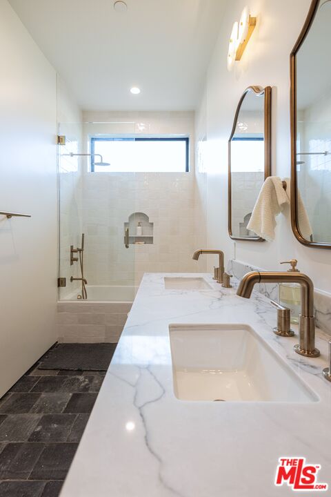 4703 Saloma Avenue Sherman Oaks, CA 91403 - Photo 20 of 26 a bathroom with a sink and a mirror