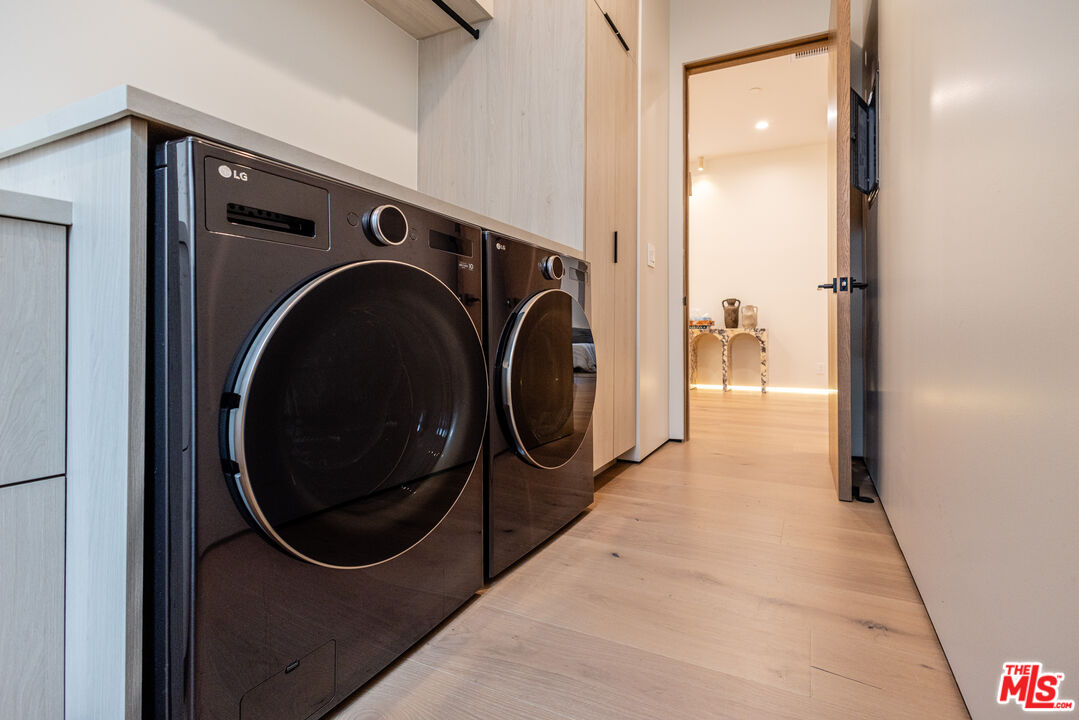 4703 Saloma Avenue Sherman Oaks, CA 91403 - Photo 21 of 26 a view of a storage & utility room with a washer dryer