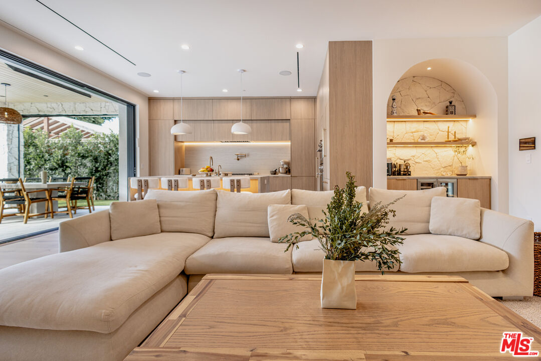 4703 Saloma Avenue Sherman Oaks, CA 91403 - Photo 22 of 26 a living room with furniture and a large window