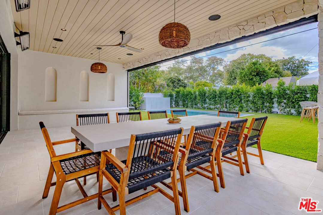 4703 Saloma Avenue Sherman Oaks, CA 91403 - Photo 24 of 26 a dining space with furniture and garden view