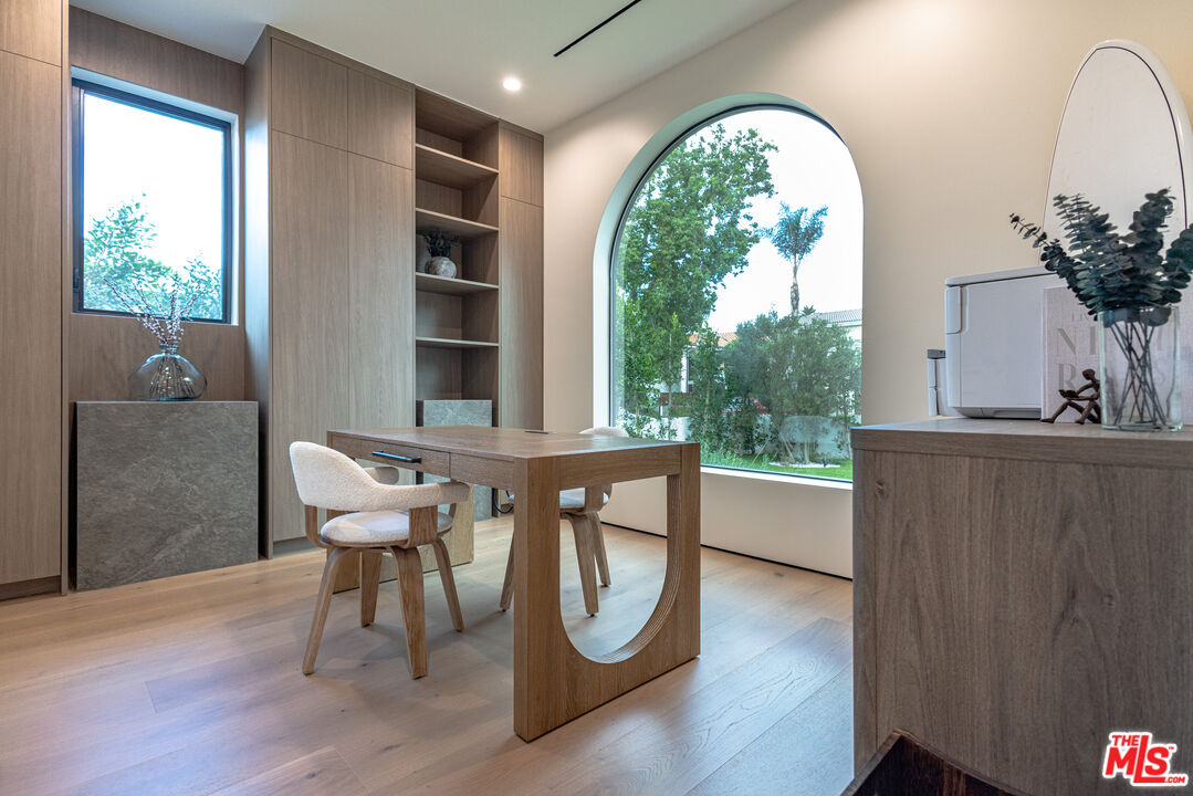 4703 Saloma Avenue Sherman Oaks, CA 91403 - Photo 10 of 26 a living room with furniture a window and wooden floor