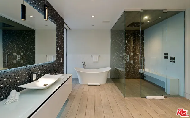 a bathroom with a bathtub and a toilet