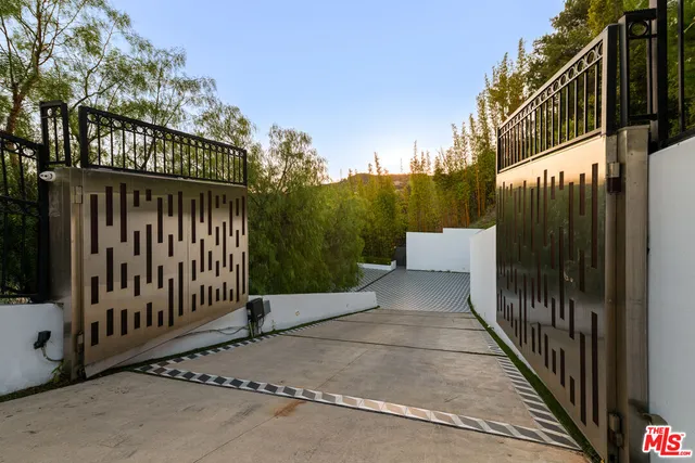 a view of a building with wooden fence