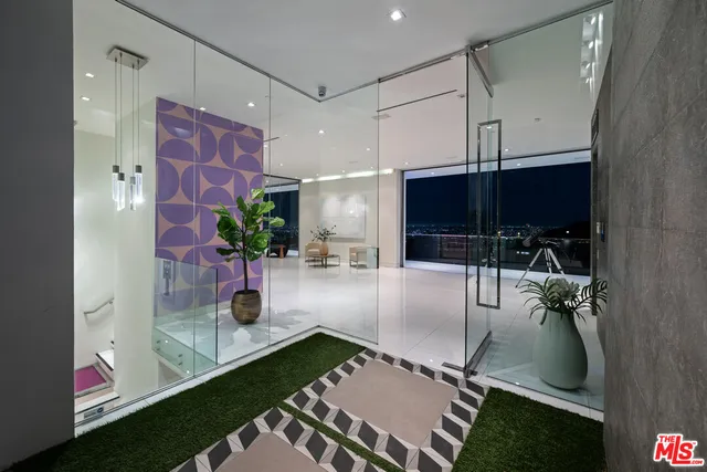 a room with patio outer view and wooden floor