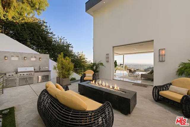 a outdoor living space with furniture and a potted plant