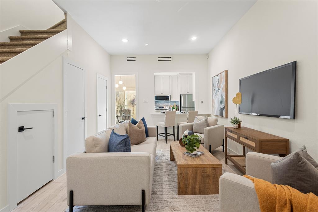 2806 Knight Street, Unit 103 Dallas, TX 75219 - Photo 1 of 17 a living room with furniture and a flat screen tv
