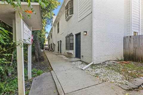 a view of a pathway front of house
