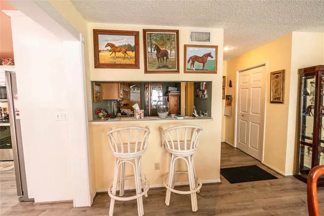 a view of a dining room with furniture wooden floor and window