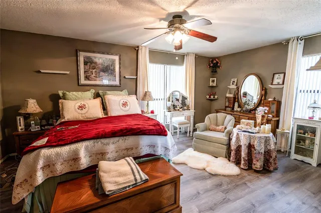 a bed room with furniture and a chandelier