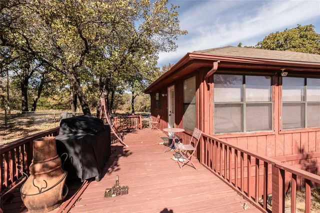 a view of a two chair and tables in the balcony