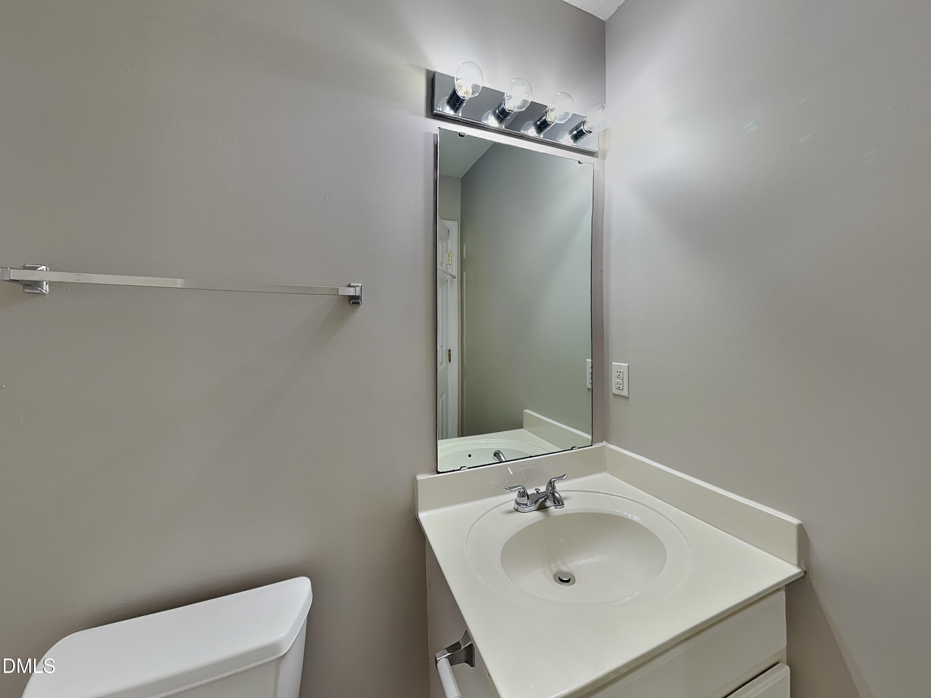 8109 Bright Oak Trail Raleigh, NC 27616 - Photo 13 of 15 a bathroom with a sink toilet and mirror
