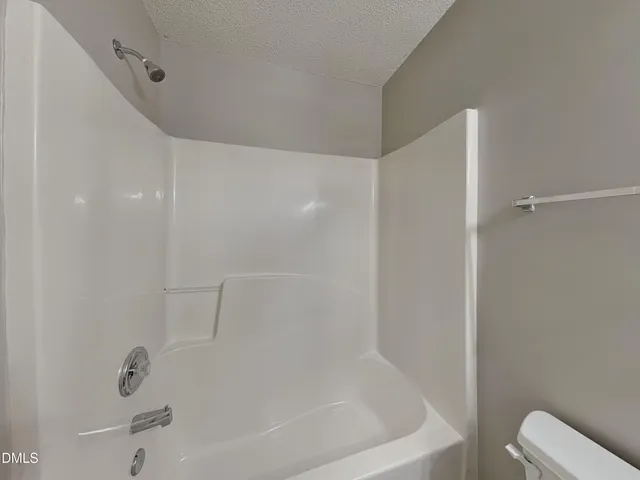 a close view of a bathtub in bathroom