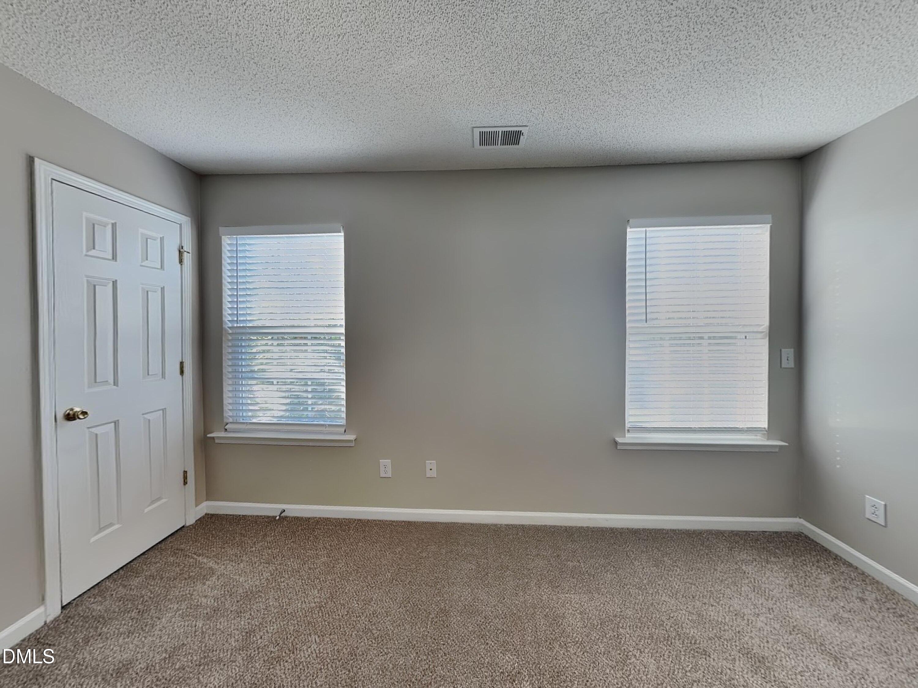 8109 Bright Oak Trail Raleigh, NC 27616 - Photo 6 of 15 an empty room with a window