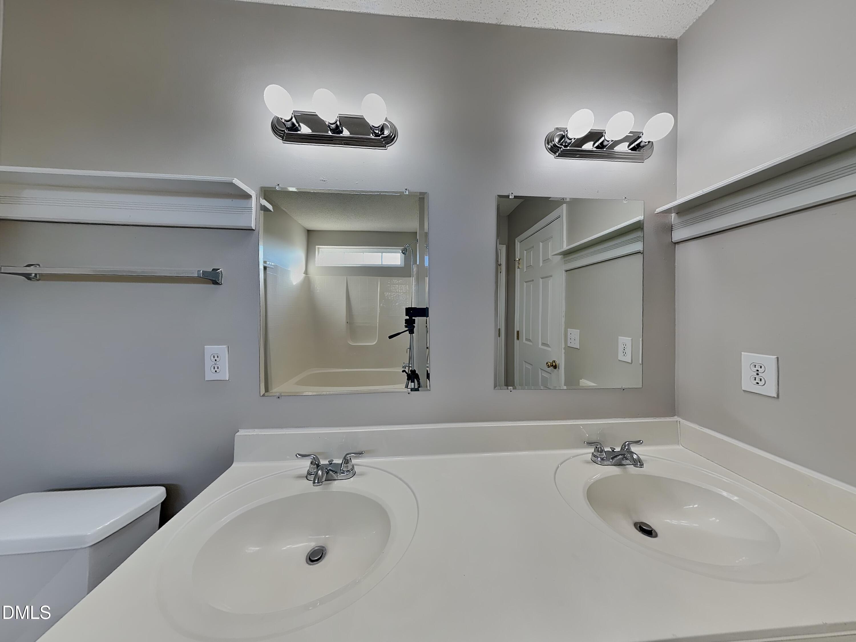 8109 Bright Oak Trail Raleigh, NC 27616 - Photo 7 of 15 a bathroom with a sink and a mirror