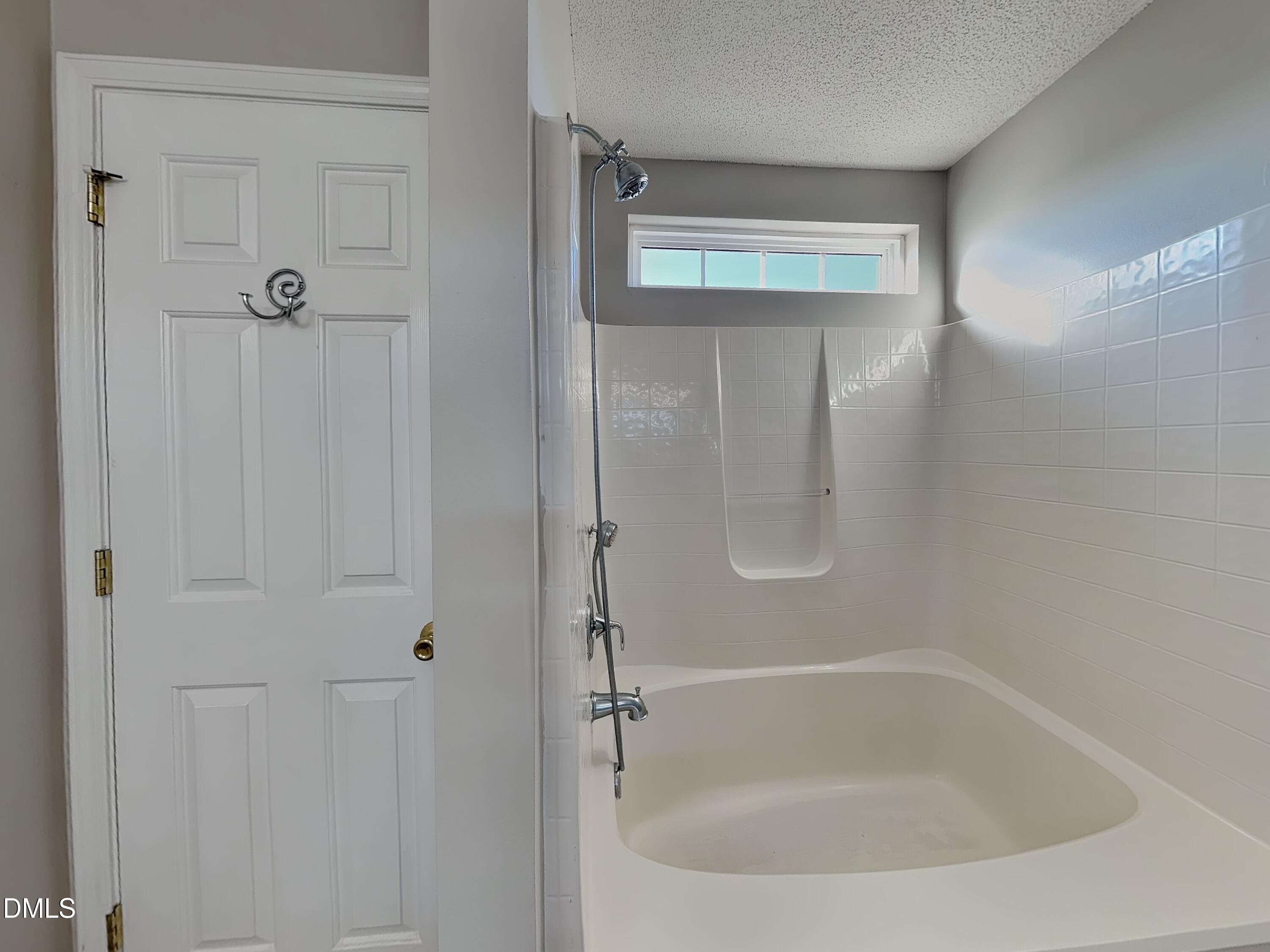 8109 Bright Oak Trail Raleigh, NC 27616 - Photo 8 of 15 a bathroom with a tub