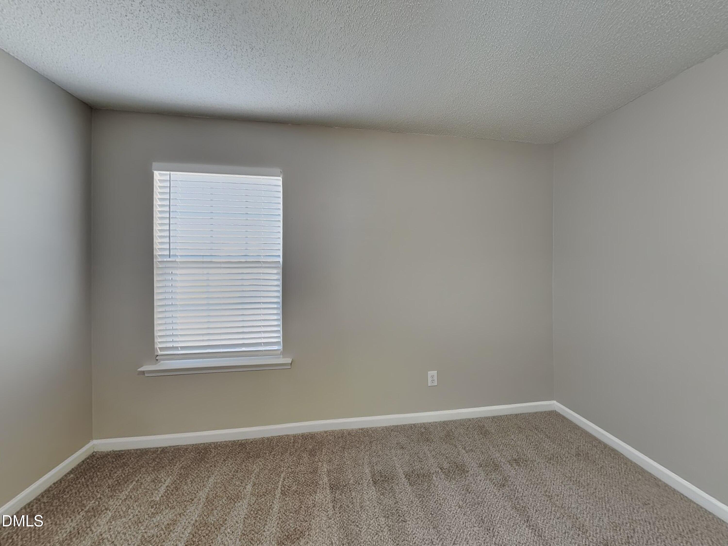 8109 Bright Oak Trail Raleigh, NC 27616 - Photo 9 of 15 an empty room with a window