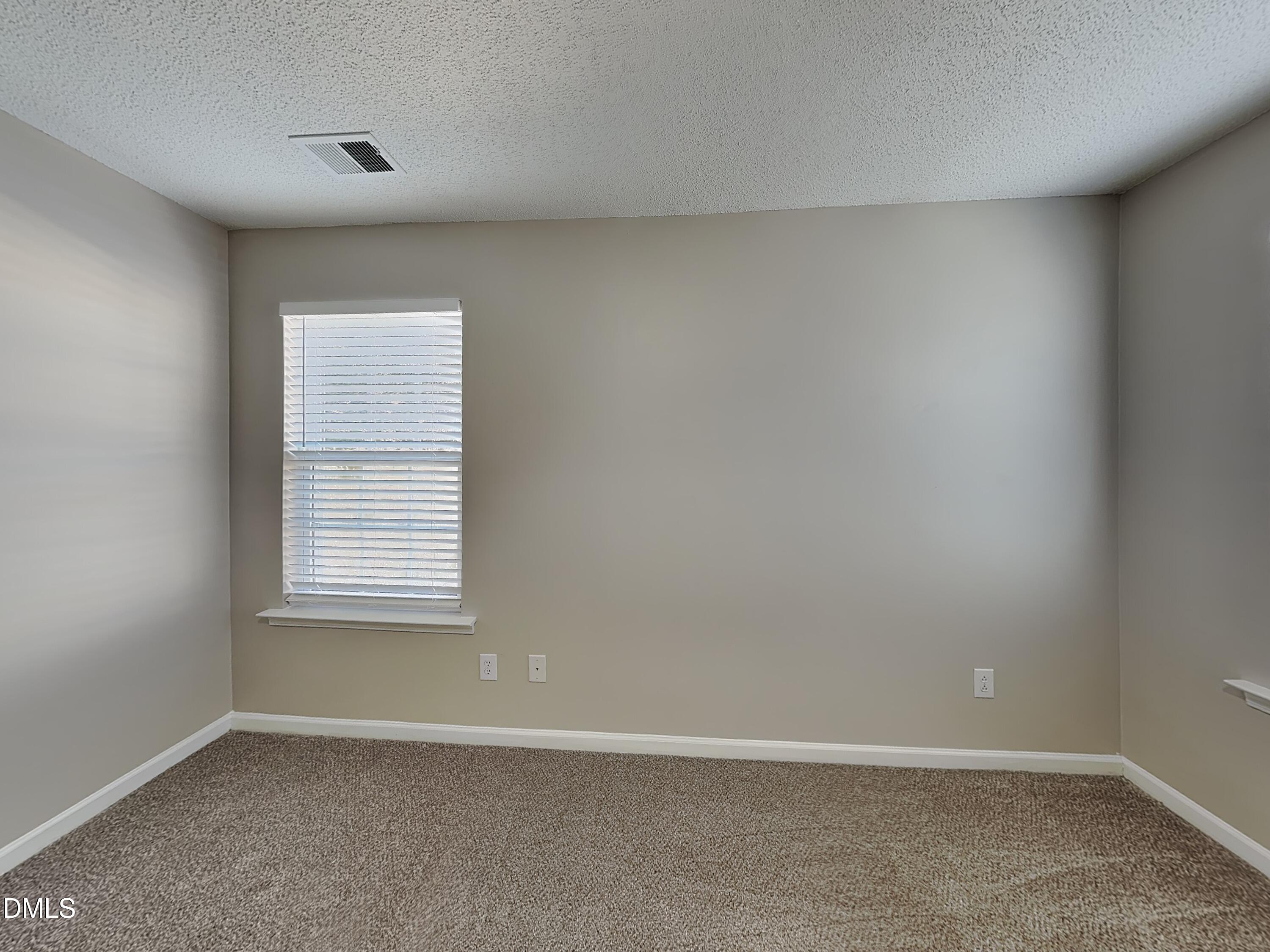 8109 Bright Oak Trail Raleigh, NC 27616 - Photo 10 of 15 an empty room with a window
