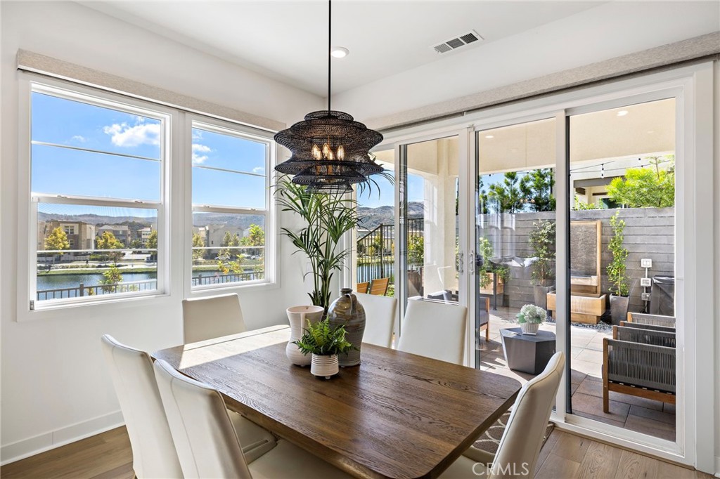 896 Sunrise Road Rancho Mission Viejo, CA 92694 - Photo 18 of 42 a view of a dining room with furniture window and wooden floor