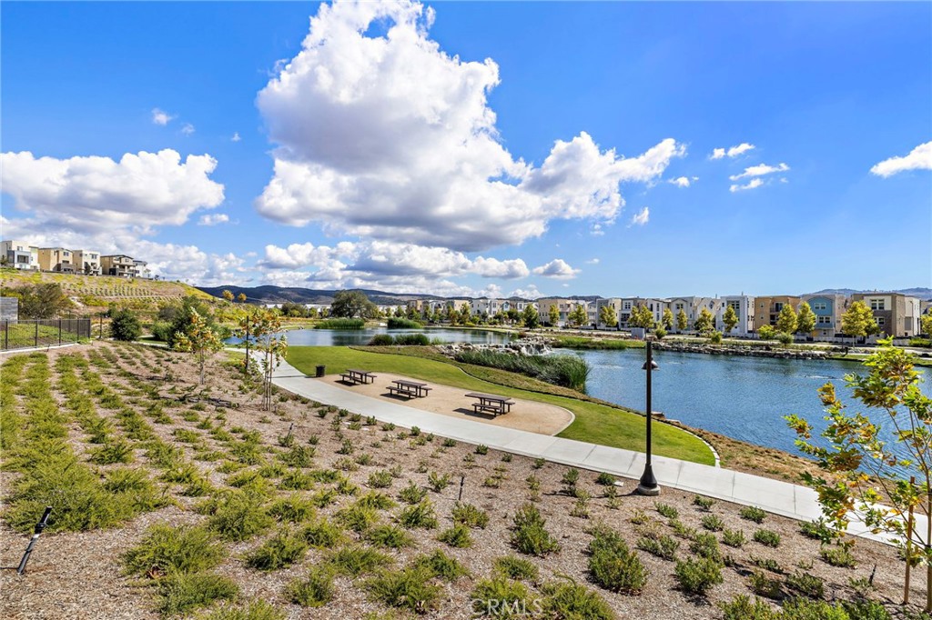 896 Sunrise Road Rancho Mission Viejo, CA 92694 - Photo 26 of 42 a view of a lake with a nearby beach