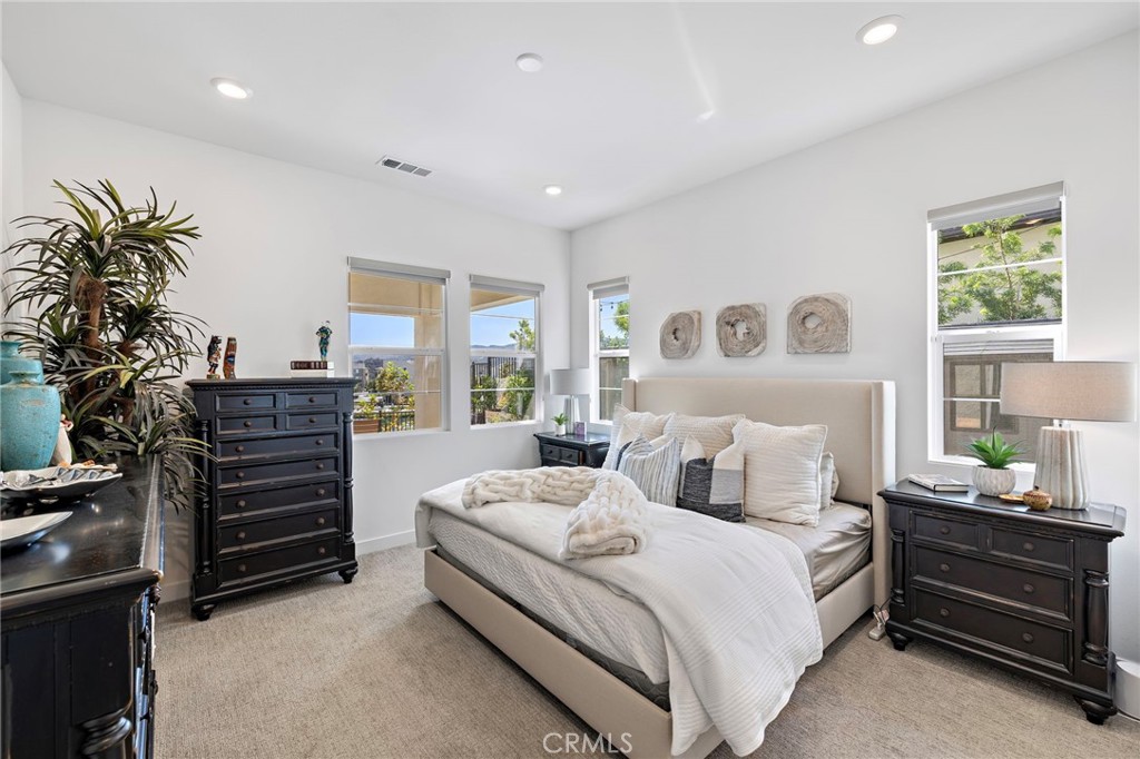 896 Sunrise Road Rancho Mission Viejo, CA 92694 - Photo 28 of 42 a bedroom with a bed and a window