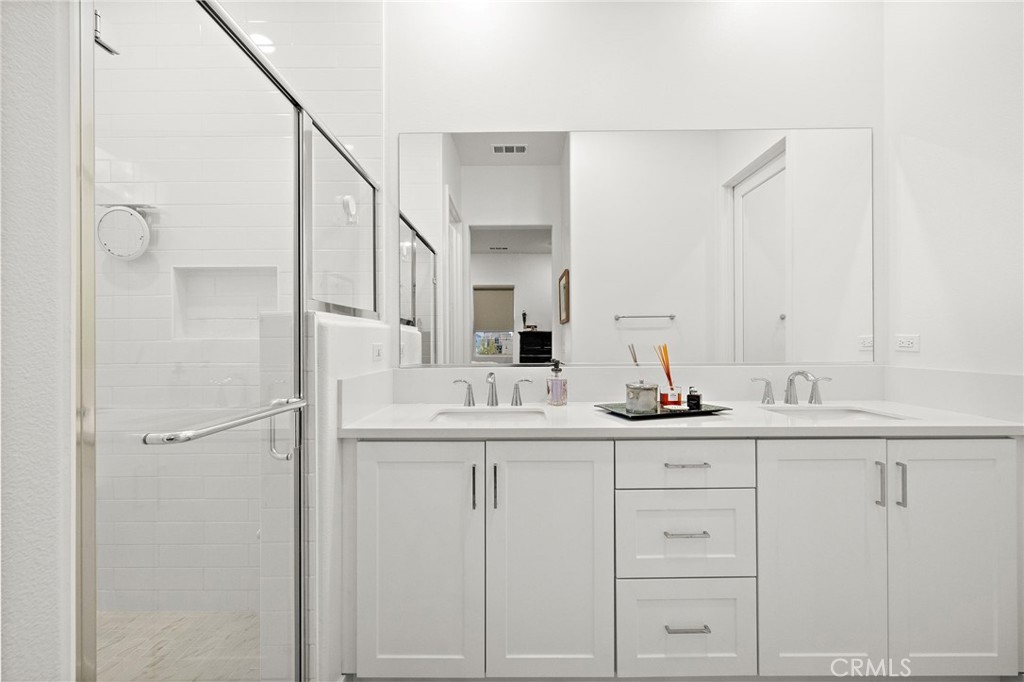 896 Sunrise Road Rancho Mission Viejo, CA 92694 - Photo 30 of 42 a bathroom with a sink and a mirror