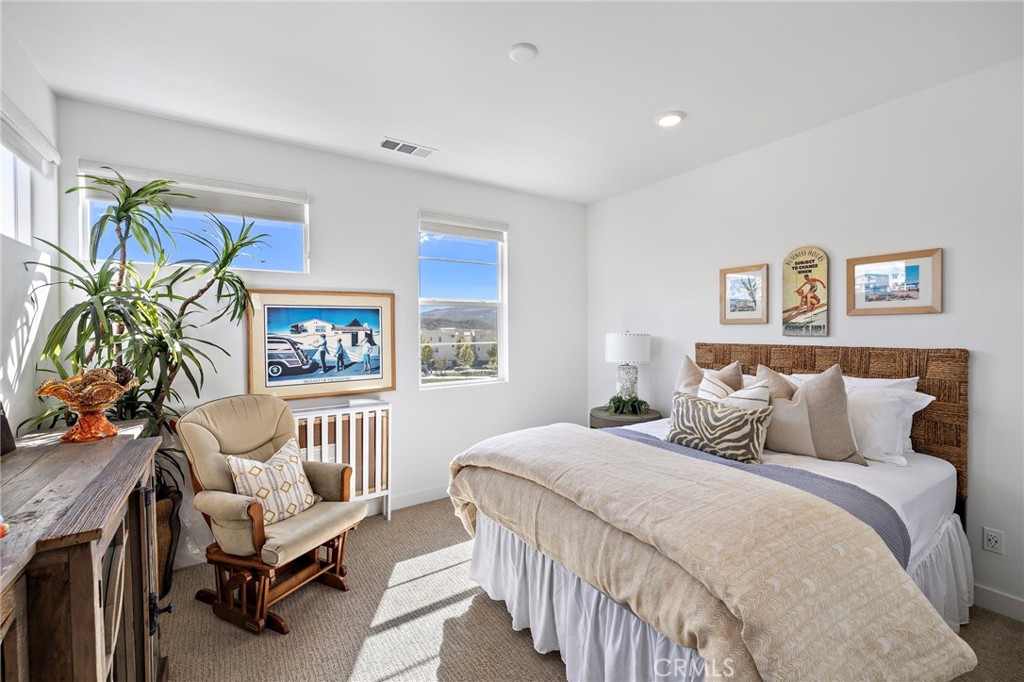 896 Sunrise Road Rancho Mission Viejo, CA 92694 - Photo 31 of 42 a bedroom with a bed and a couch