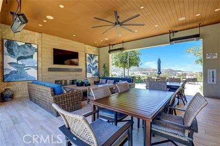 896 Sunrise Road Rancho Mission Viejo, CA 92694 - Photo 41 of 42 a living room with furniture and a flat screen tv