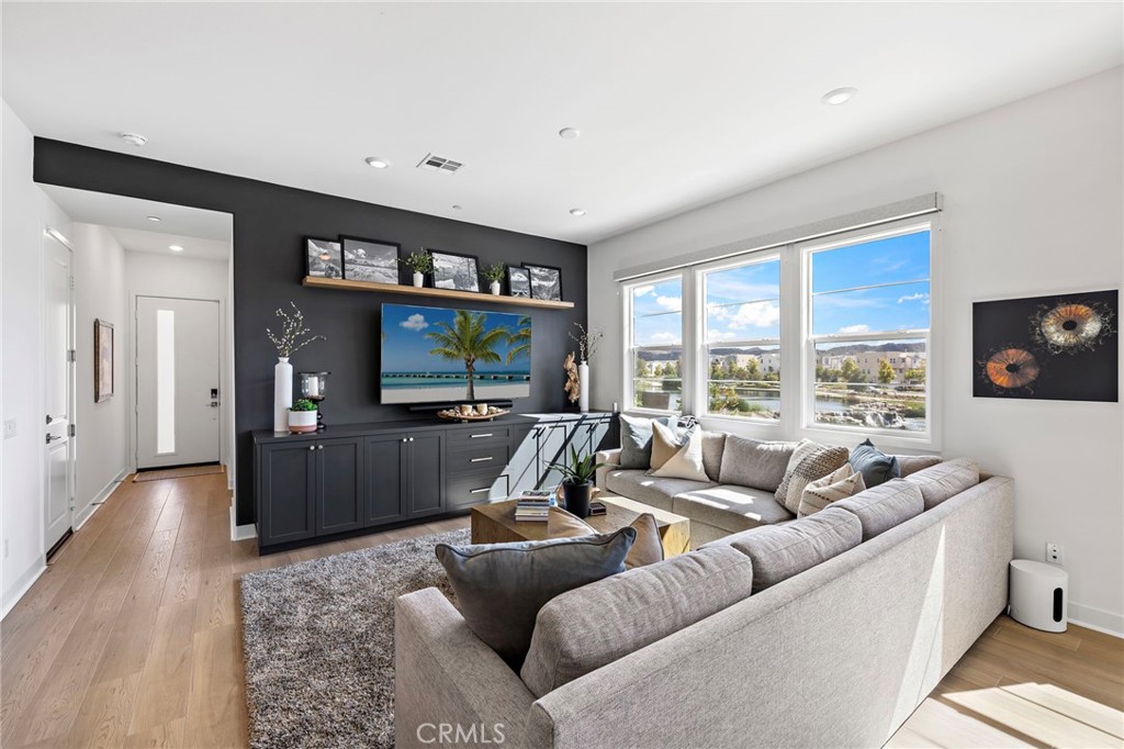 896 Sunrise Road Rancho Mission Viejo, CA 92694 - Photo 10 of 42 a living room with furniture and a flat screen tv