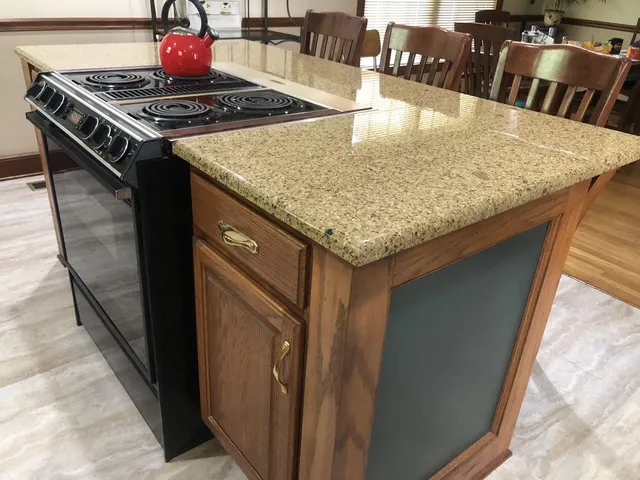 a kitchen with a stove and a sink