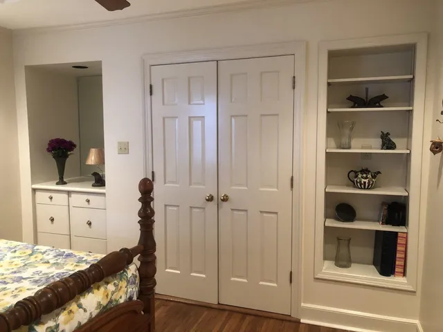 a bedroom with a bed and a cabinets