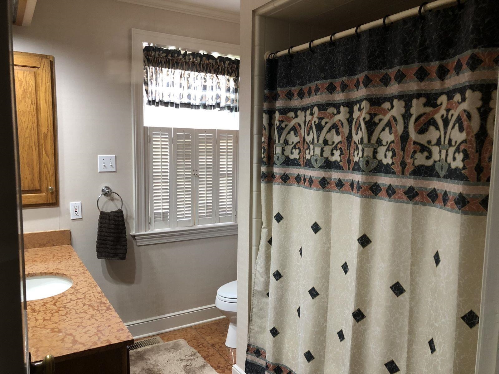 3334 Oak Road Bartlett, TN 38135 - Photo 24 of 40 a bathroom with a granite countertop sink and a mirror