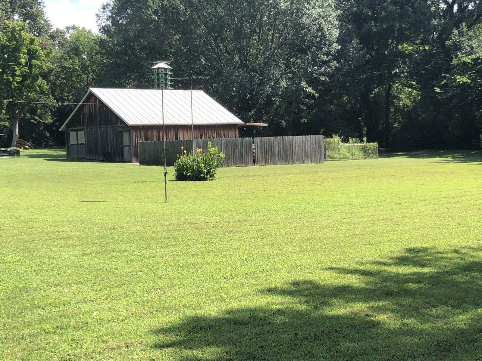 3334 Oak Road Bartlett, TN 38135 - Photo 3 of 40 a patio with table and chairs under an umbrella