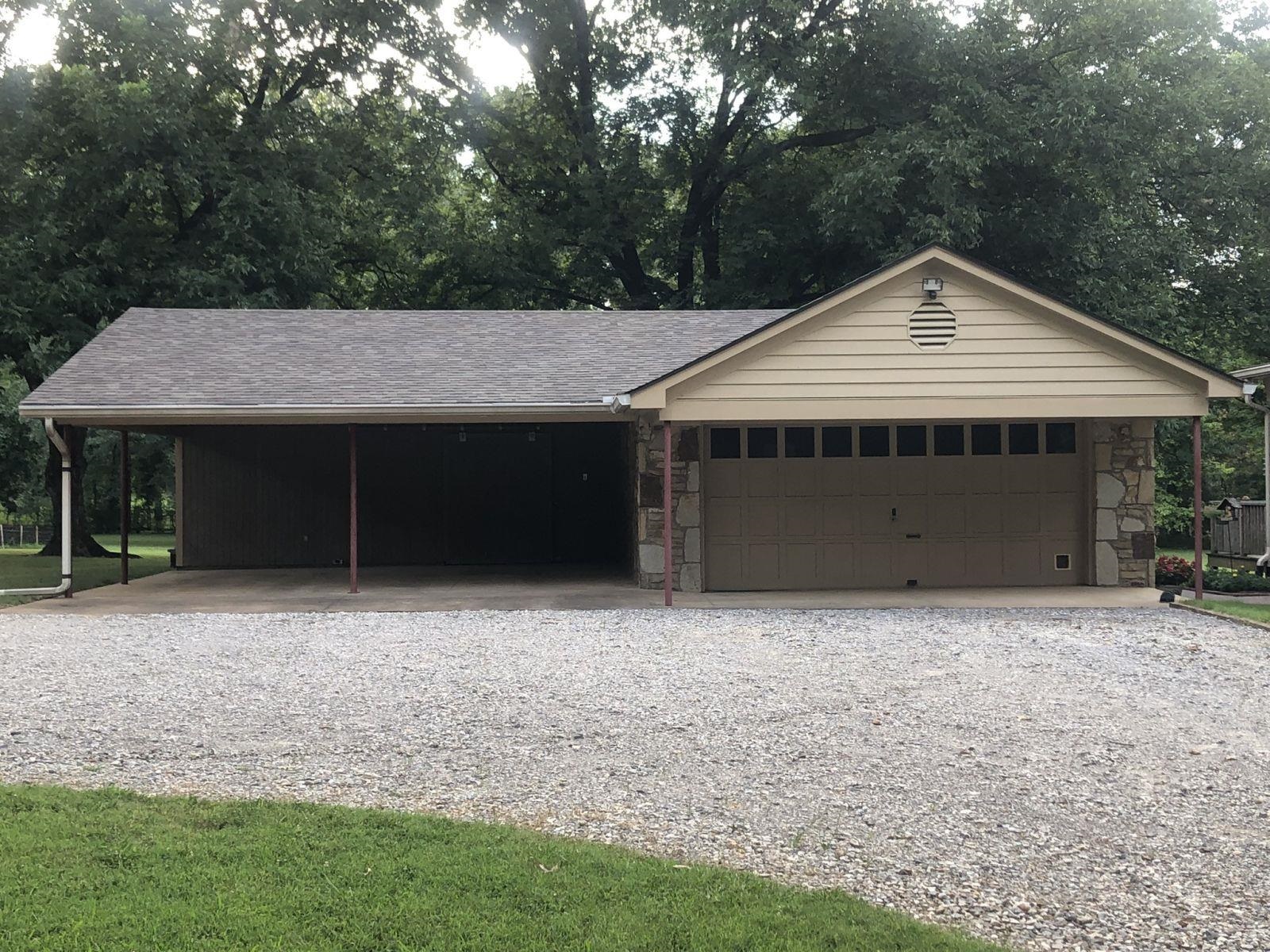 3334 Oak Road Bartlett, TN 38135 - Photo 31 of 40 a front view of a house with a garden and trees