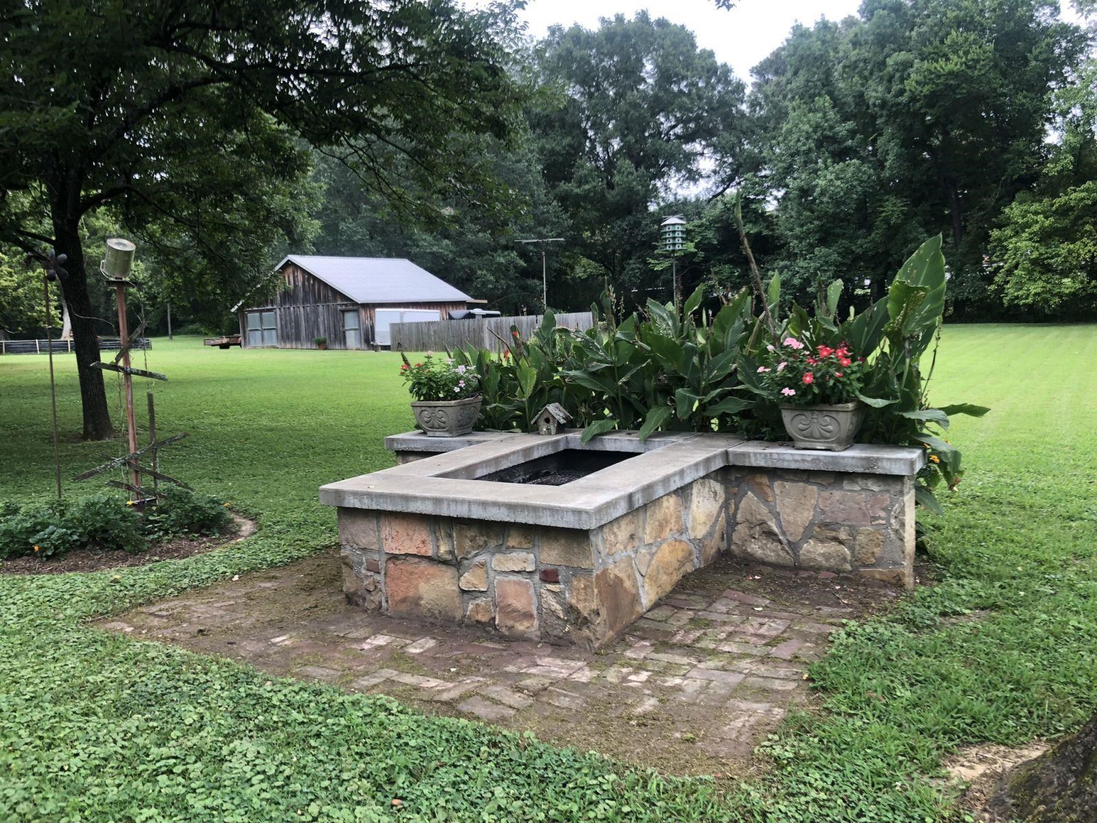 3334 Oak Road Bartlett, TN 38135 - Photo 39 of 40 a view of a backyard with plants and outdoor seating