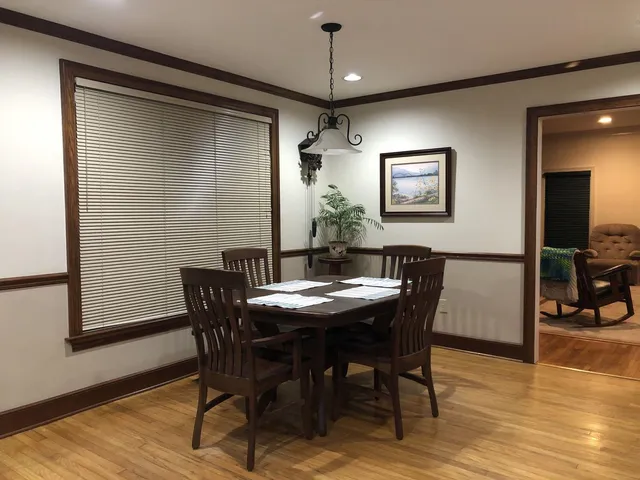 a dining room with furniture and window