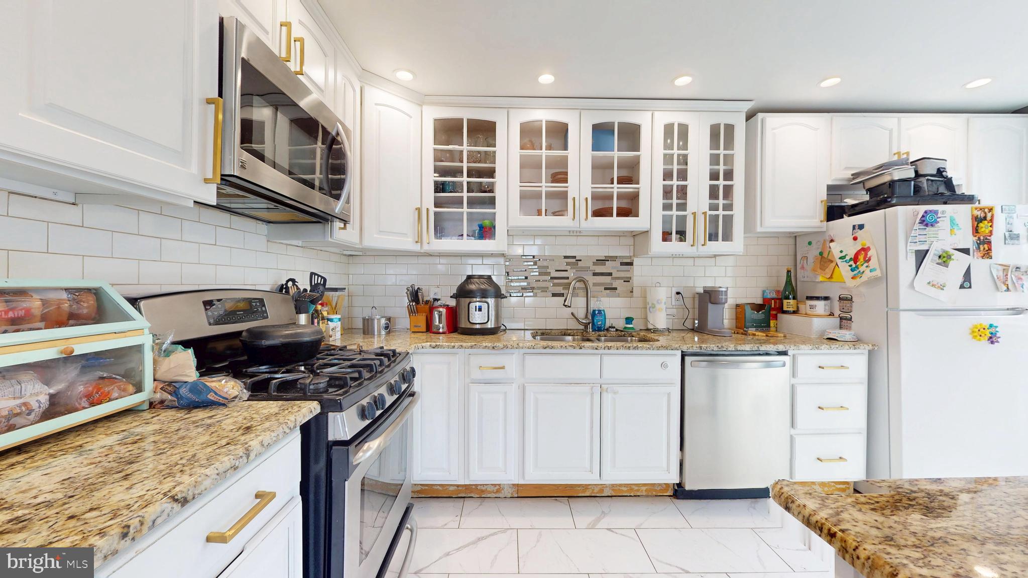 204 Haddon Avenue Collingswood, NJ 08108 - Photo 14 of 34 a kitchen with stainless steel appliances granite countertop a stove and a sink