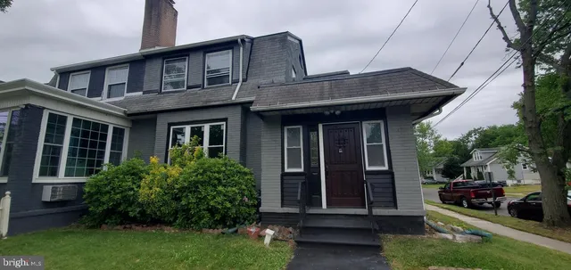 a view of a brick house with a large windows